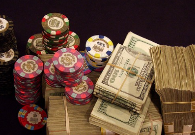 Poker table with chips and cards representing bankroll management.