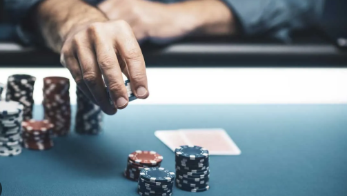 "Professional athlete playing poker at a table, focusing on strategy and decision-making"