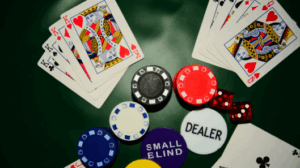 alt="Poker player folding their hand by pushing cards toward the dealer during a game"